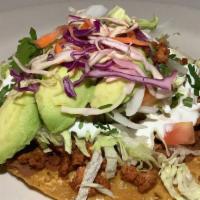 Tostada Pollo · Chicken, served with Mexican rice, beans and salad