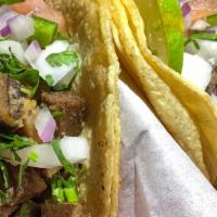 Lengua Taco · Beef tongue , onion, cilantro