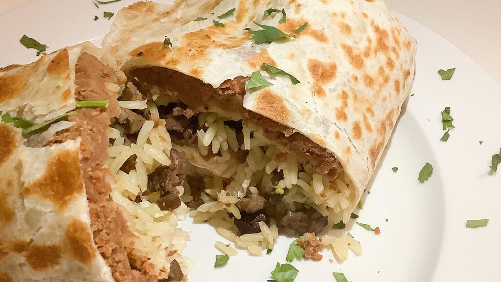 Burrito Lengua · Beef tongue a flour tortilla wrap ,served with lettuce ,tomato, Mexican rice, beans ,sour cream and avocado