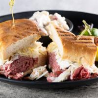 Hot Corned Beef Sandwich · Specialty corned beef on a pressed rye bread, sauerkraut, and thousand island dressing.