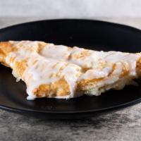 Apple Turnover · Sweet apples folded into a triangle pastry with a vanilla icing drizzle.