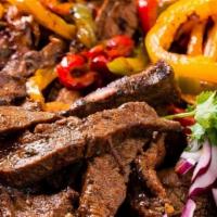 Steak Fajitas · Strip steak, red peppers, green peppers, yellow peppers and onions. Served with rice, beans ...