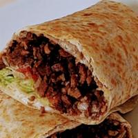 Carne Asada Burrito · Steak. Rolled in a flour tortilla with beans, lettuce, tomato, sour cream and cheese.