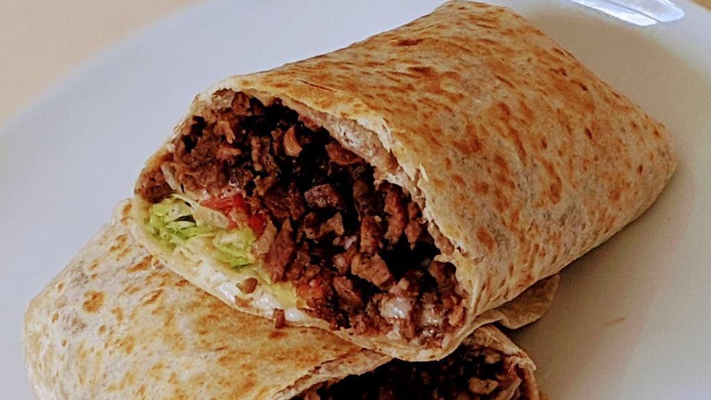 Carne Asada Burrito · Steak. Rolled in a flour tortilla with beans, lettuce, tomato, sour cream and cheese.