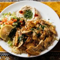Chicken Shawarma · Grilled, thinly sliced, marinated chicken thigh served with basmati rice, green salad, hummu...