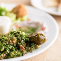 Veggie Combination · hummus, baba ghannouj, tabbouleh salad, green salad, falafel, stuffed grape leaves, pita bre...