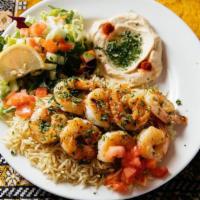 Grilled Jumbo Shrimp · Grilled jumbo shrimp served with basmati rice, hummus, green salad, pita bread and tartar sa...