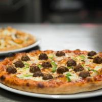 Monster Pizza · Gourmet Italian sausage, meatball, pepperoni, Canadian bacon, onion, black & green olives, m...