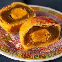 Lotus Cookie With Egg Yolk - 莲花蛋黄酥 · Flaky pastry cookie filled with lotus paste and egg yolk. Dairy free. Contains peanut oil.