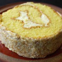 Coconut Cream Roll Slice - 椰絲蛋卷 · A slice of our vanilla flavored sponge cake rolled in buttercream and topped with toasted co...