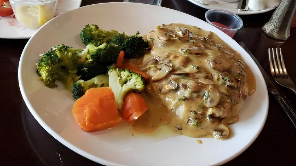 Chicken Marsala · Sautéed chicken breasts topped with sautéed onions, mushrooms and Marsala wine. Served with vegetable and choice of potato.