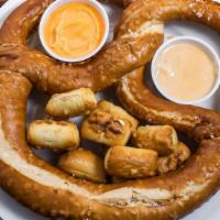 The Monster Pretzel · An extra large baked Bavarian pretzel topped with pretzel nuggets and comes with beer cheese.
