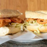 Catfish Po' Boy · French bread , cajun batter catfish strip , shredded lettuces, tomatoes and remoulade sauce