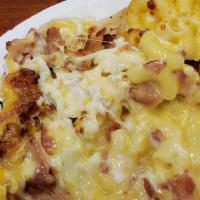 Mac- N- Cheese Pizza · Macaroni and cheese based pizza topped with bacon and three cheese blend.