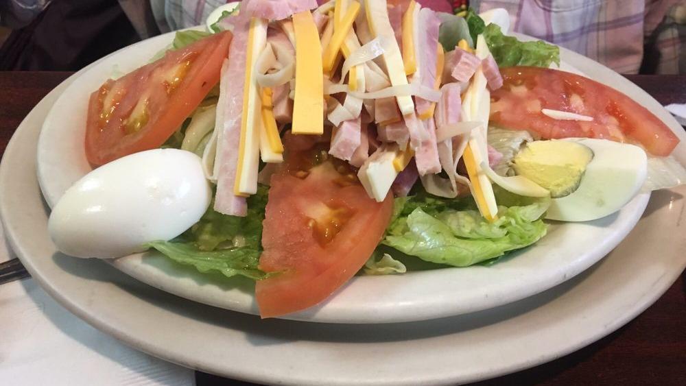 Julienne Salad (Large) · Lettuce, tomatoes, ham, American and swiss cheese, fresh turkey and egg.