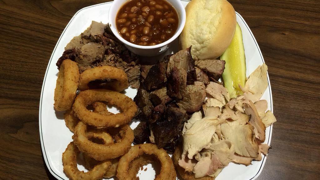 Triple D Platter · Eat what Guy Fieri ate: burnt ends, brisket, and turkey (no substitutions). Also includes three side dishes, choice of bread, and pickles.