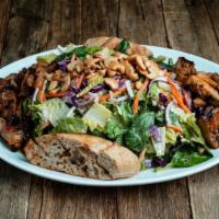 Sesame Ginger Chicken Salad · Grilled Sweet Chili-Glazed Chicken, Carrots, Red Onion, Cabbage, Cashews.