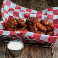 Crispy Fried Chicken Wings · Szechuan, Buffalo, Berbere Dry Rub.
