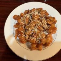 Sesame Chicken · Deep-fried breaded chicken in sweet sauce topped with toasted sesame seeds. Served with whit...
