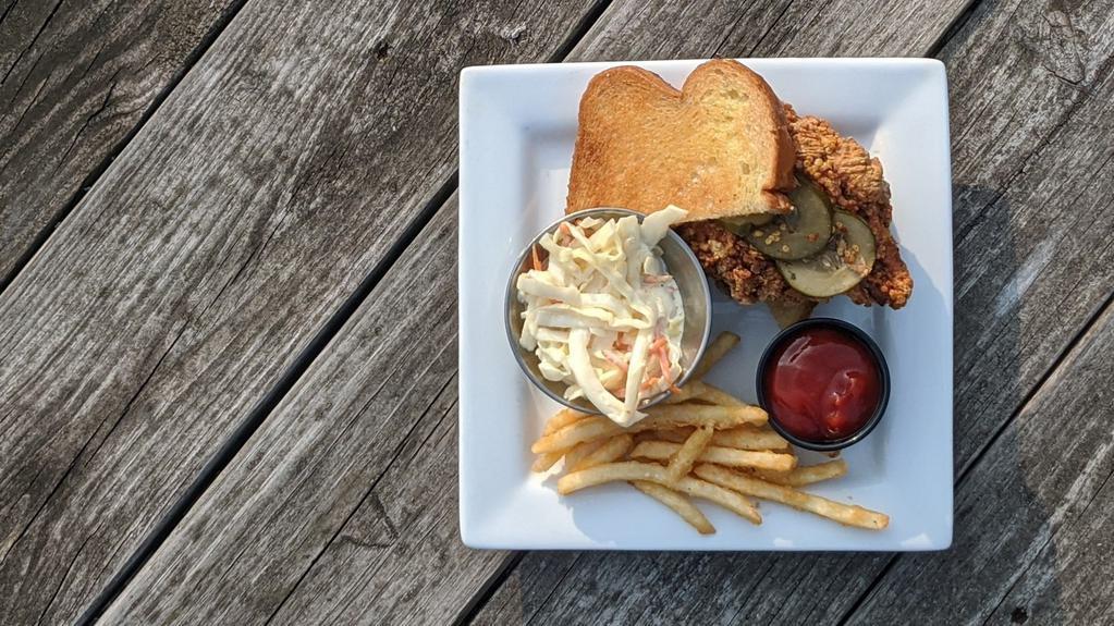 Nashville Hot Chicken Sandwich · Hand-breaded and marinated chicken breast topped with nashville hot sauce and house-made pickles on griddled white bread. Served with fries and coleslaw.