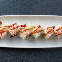 Rising Sun Roll · Shrimp tempura, kani, cucumber, topped with snow crab mix, tempura flakes, spicy mayo and un...