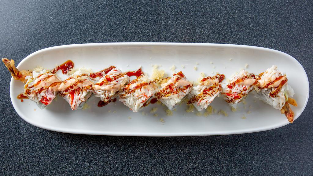 Rising Sun Roll · Shrimp tempura, kani, cucumber, topped with snow crab mix, tempura flakes, spicy mayo and unagi sauce.
