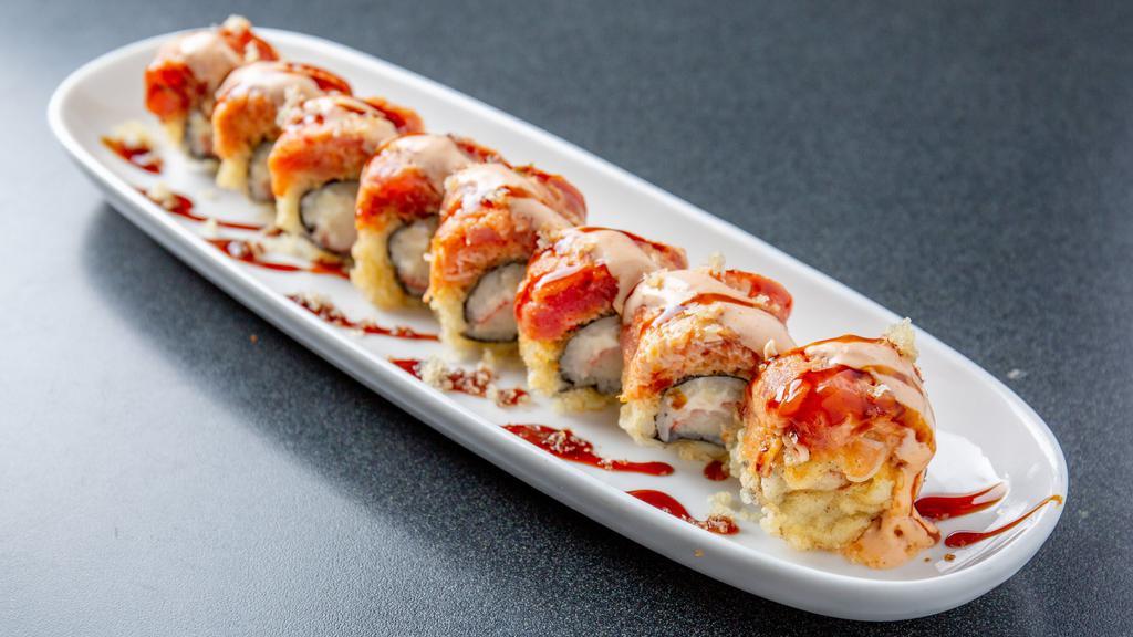 Dragon Roll · Shrimp tempura, snow crab mix, spicy tuna, topped with eel, tuna, avocado, scallions, masago and unagi sauce.