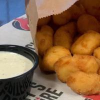 Cheese Curds · Fried breaded cheese curds with a side of lemon garlic dill sauce