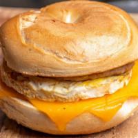 Bagel Breakfast Sandwich  · New York style plain bagel toasted with cheddar cheese, egg and choice of breakfast meat.