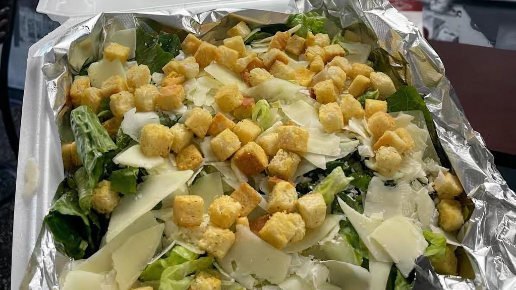 Caesar Salad · Romaine lettuce, croutons, parmesan tossed in Caesar dressing.