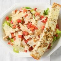 Chicken Caesar Salad · Romaine lettuce, tomatoes, 100% natural roasted chicken, and shaved Parmesan cheese and a si...