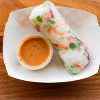 Spring Roll With Thai Peanut Sauce · Spring Roll made with thin rice noodles, chicken, carrots, lettuce, cilantro and chives. Ser...