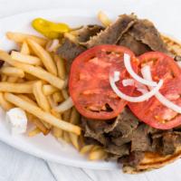 Gyros Sandwich · A special combination of lamb and beef cooked slowly cooked on a vertical spit served on a f...