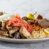Gyro Plate · A special combination of lamb and beef slowly cooked on a vertical pit served open face with...