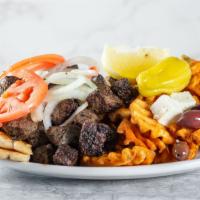 Beef Shish Kabob Plate · Small pieces of marinated choice beef served on pita bread with fresh onions and tomatoes al...