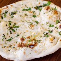 Garlic Naan · Clay oven baked bread brushed with fresh Garlic.