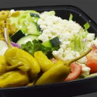 Greek Salad · Mixed lettuce, cucumber, tomato, onion, green olives, pepperoncini peppers, and feta cheese.