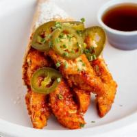Spicy Chick · Crispy buttermilk chicken drenched in our signature sriracha infused maple sauce topped with...