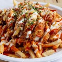 Buffalo Cheese Fries · Crispy fries drenched in our signature Monterey-Jack Queso sauce, drizzled with medium heat ...