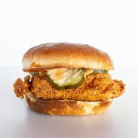 Classic Sandwich · OUR CLASSIC BUTTERMILK CHICKEN ON A TOASTED BUN WITH PICKLES , SLAW AND OUR NEW CHICK-IN SAU...