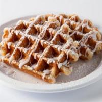 Waffle Bites · Crispy and Sweet Belgian Waffle bites topped with icing and  powdered sugar.