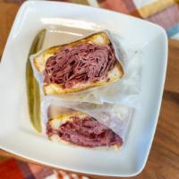 Corned Beef Sandwich · Nine ounce, served on rye or onion roll with mustard and swiss cheese.
