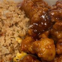 General T'So Chicken · Served with fried rice and 1 egg roll or 3 crab rangoon.