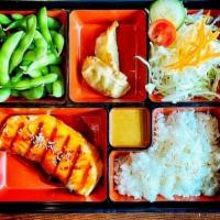 Salmon Teriyaki Bento · Set includes grilled salmon / teriyaki / salad / edamame / age gyoza