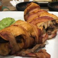 Bacon Wrapped Burrito · A 12 inch tortilla filled with steak, onion, jalapeño, avocado slices, tomato and cheese, fr...