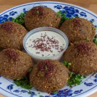 Falafel (6 Pcs) · Chickpeas ground with parsley, onions, garlic, spices shaped into balls, and deep fry to per...