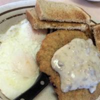 Country Fried Steak · Two eggs, five ounces country steak, crispy hash browns, toast and jelly.