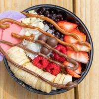 Deluxe Bowl · Organic açaí­ blend with banana and strawberries. Toppings: strawberries, bananas, blueberri...
