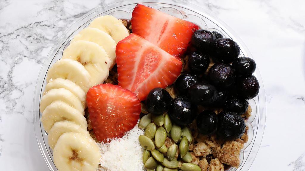Bom Dia Bowl · Organic açaí­ blend with banana and strawberries. Toppings: strawberry, banana, blueberries, organic granola, shredded coconut, sunflower seeds and agave nectar.