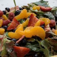 Berry Salad · Grilled chicken with mix greens, seasonal berries, mandarin oranges and candied pecans. serv...